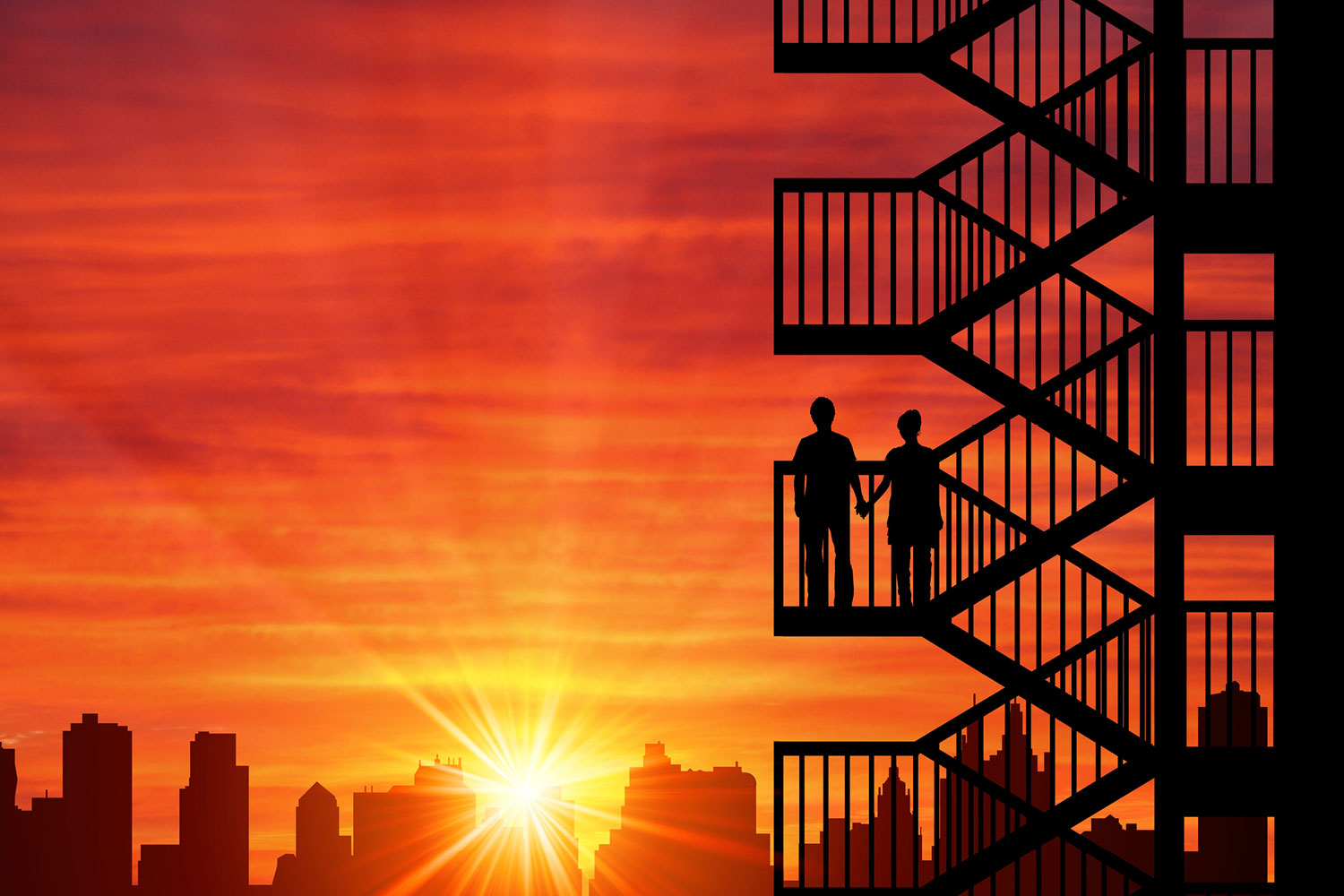 Two people holding hands on a fire escape, facing the setting sun over the NYC skyline. 